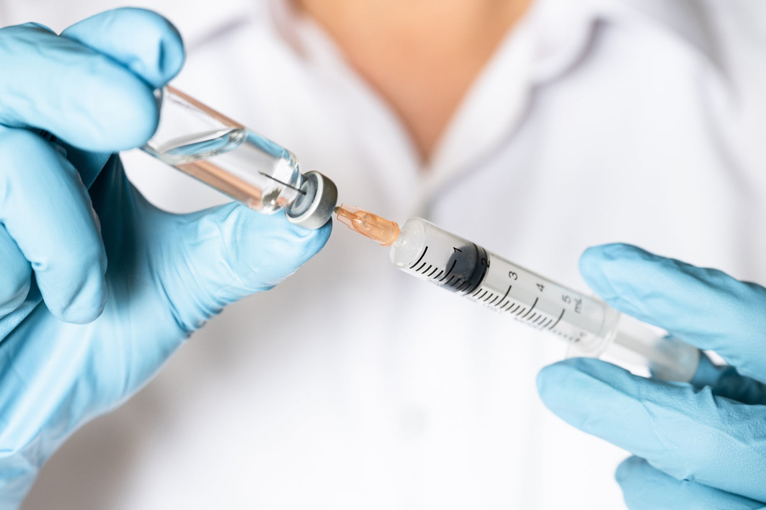 Injection shot being administered for medical treatment or vaccination.